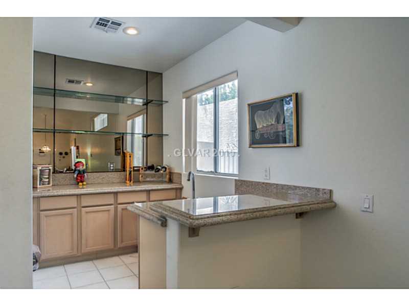 255 Chestnut Ridge Court Henderson, NV 89012 - Photo 19 of 35 Family Room. Wet Bar in Family Room
