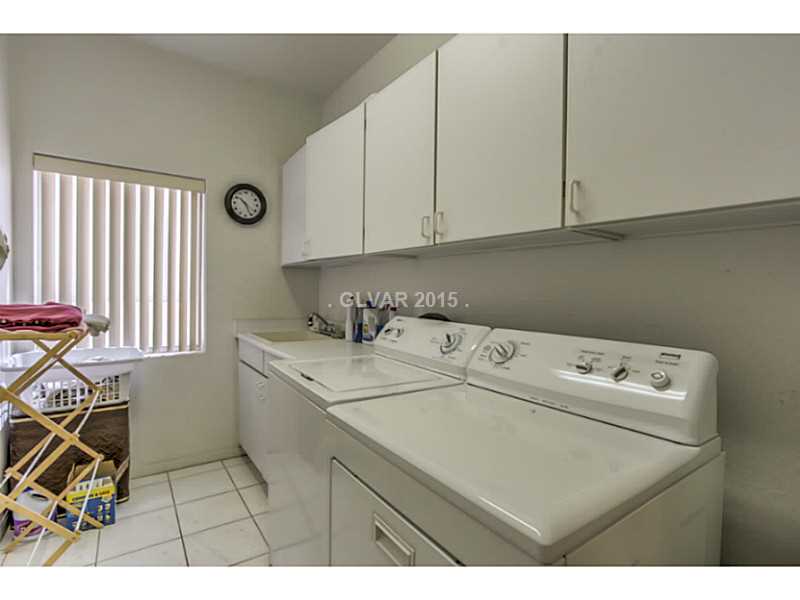 255 Chestnut Ridge Court Henderson, NV 89012 - Photo 29 of 35 Laundry Rm/Area. Large Laundry Room W/ Storage Cabinets and Rinsing Sink
