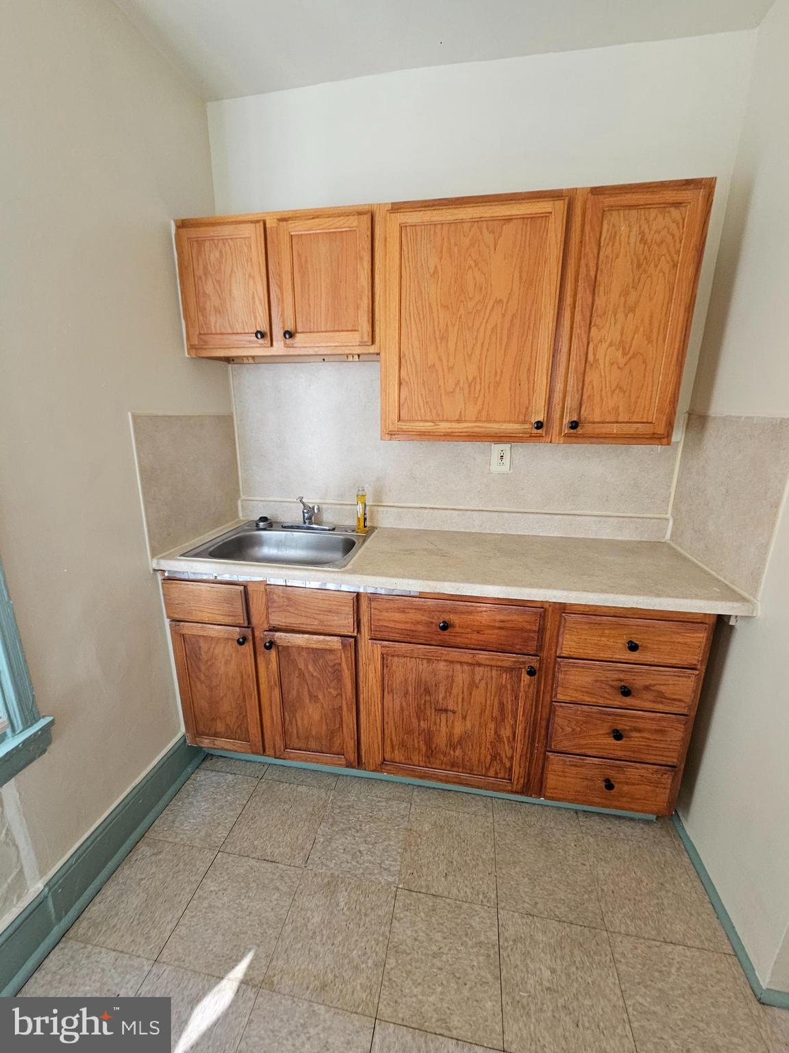 5515 North Fairhill Street Philadelphia, PA 19120 - Photo 1 of 12 a kitchen with granite countertop a sink and a stove