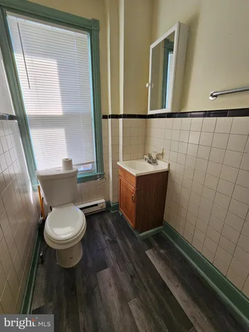 a bathroom with a toilet and a sink
