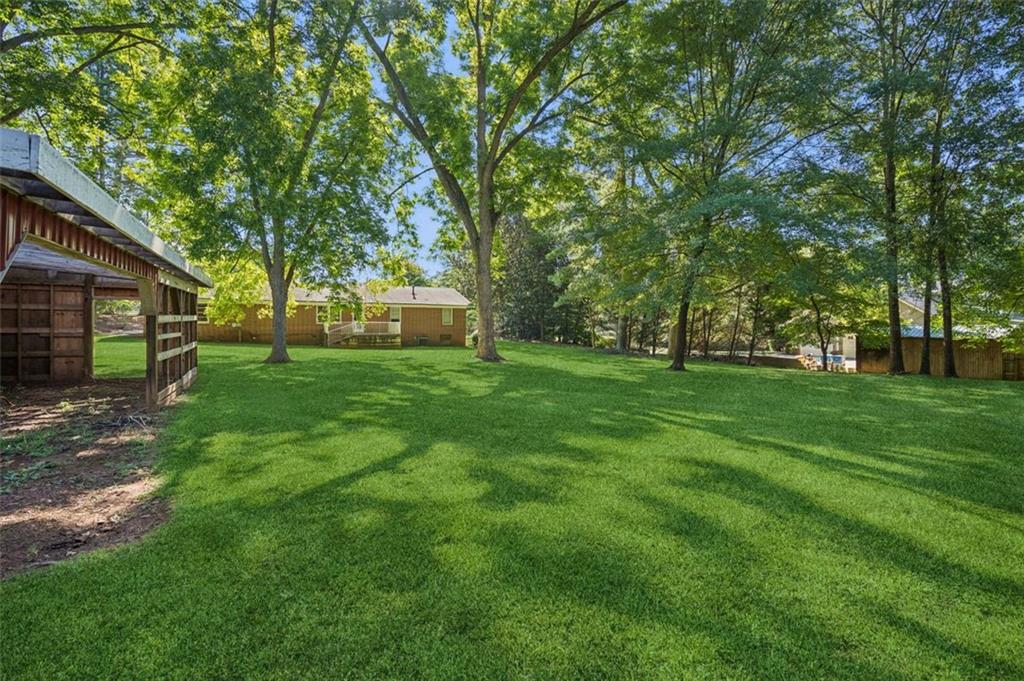 13890 Cowart Road Alpharetta, GA 30004 - Photo 12 of 33 a view of a tree in front of a house