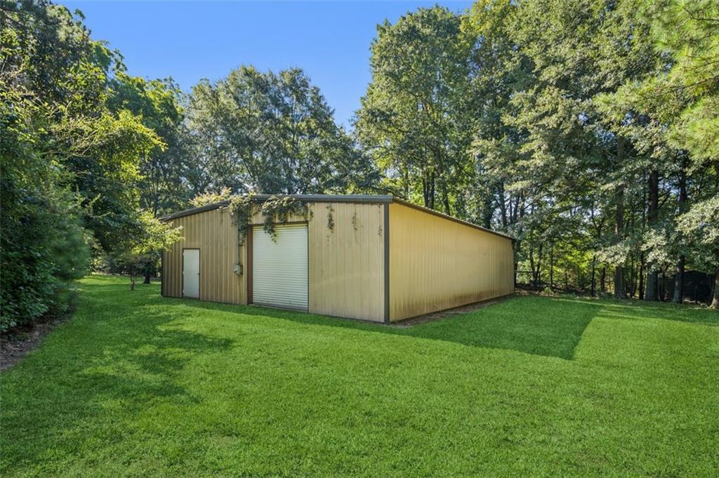 13890 Cowart Road Alpharetta, GA 30004 - Photo 14 of 33 a view of a backyard with a garden