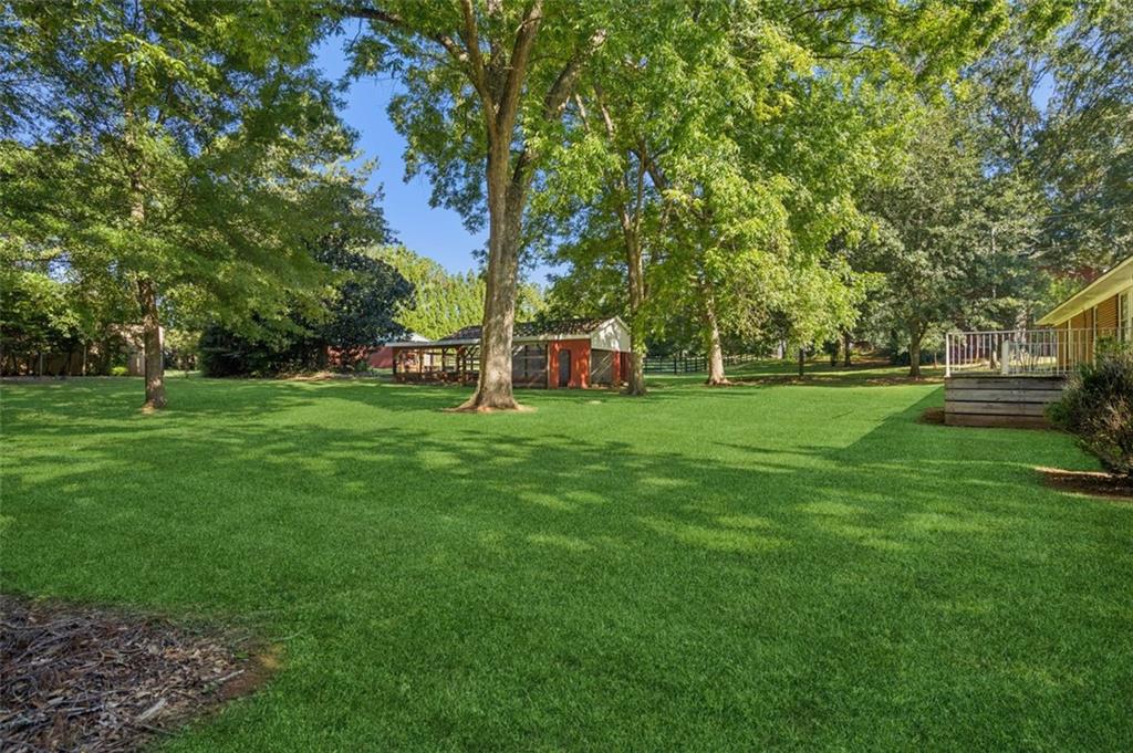13890 Cowart Road Alpharetta, GA 30004 - Photo 15 of 33 a view of a park with large trees