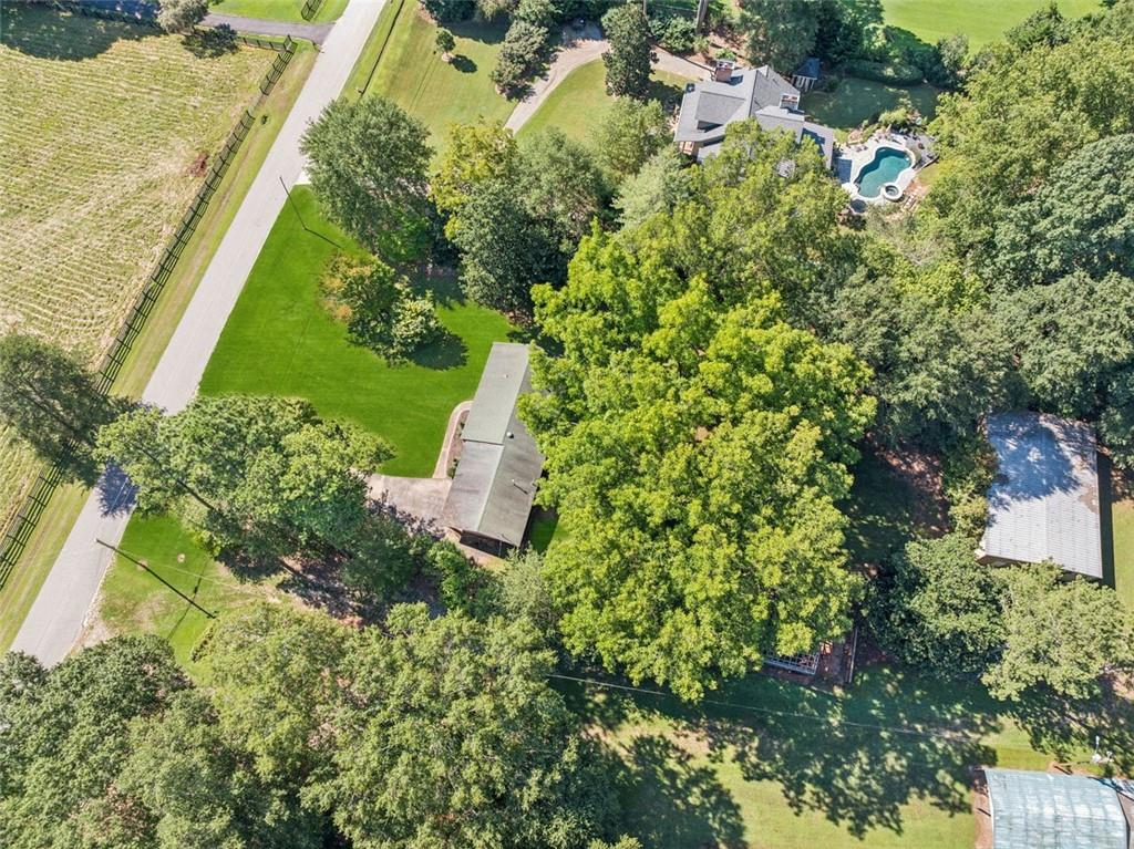 13890 Cowart Road Alpharetta, GA 30004 - Photo 17 of 33 an aerial view of a house with a yard