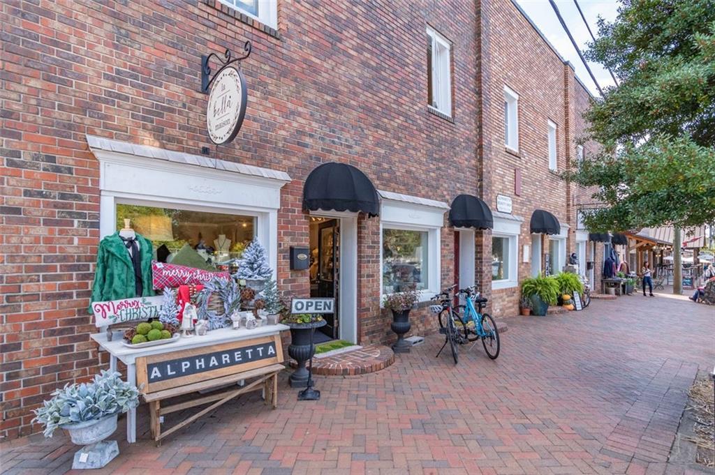 13890 Cowart Road Alpharetta, GA 30004 - Photo 25 of 33 a view of a chairs and table in the patio in front of building