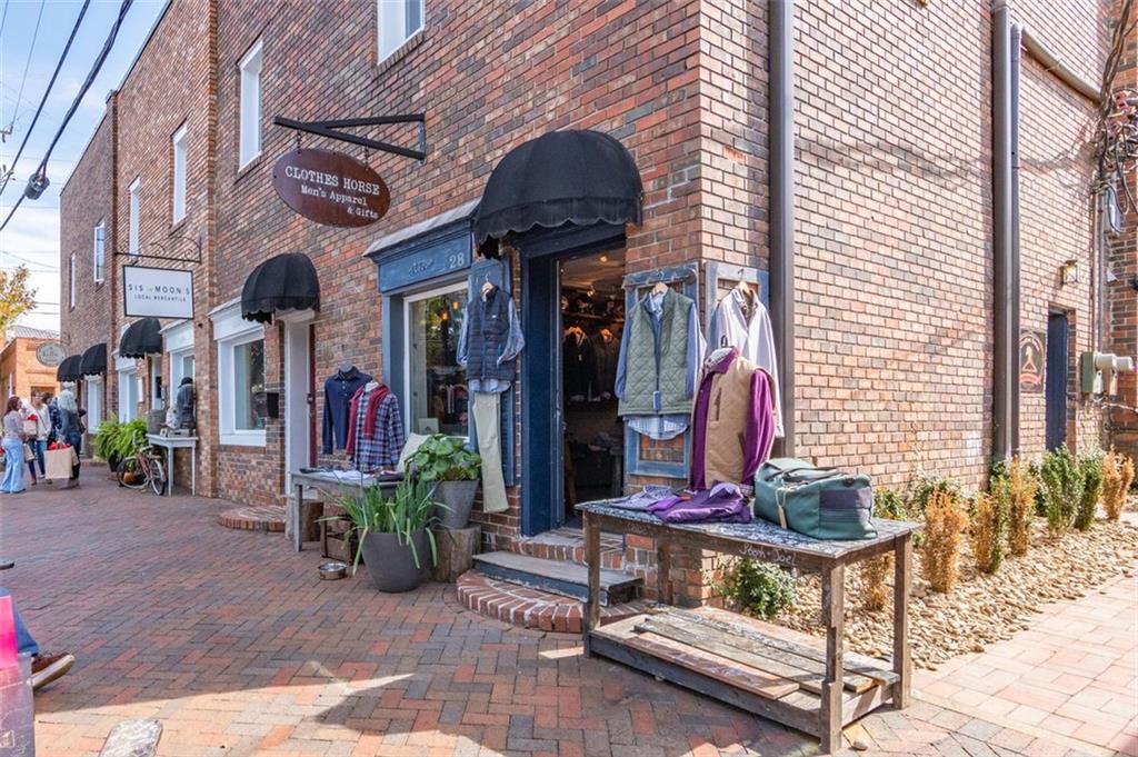 13890 Cowart Road Alpharetta, GA 30004 - Photo 27 of 33 a front view of a house with outdoor seating