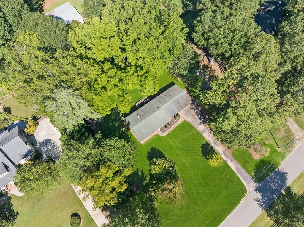 13890 Cowart Road Alpharetta, GA 30004 - Photo 5 of 33 an aerial view of a house with a yard and outdoor seating