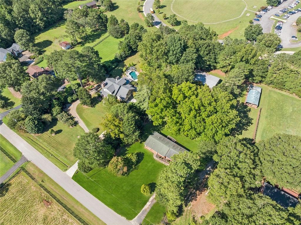 13890 Cowart Road Alpharetta, GA 30004 - Photo 6 of 33 an aerial view of a residential houses with yard