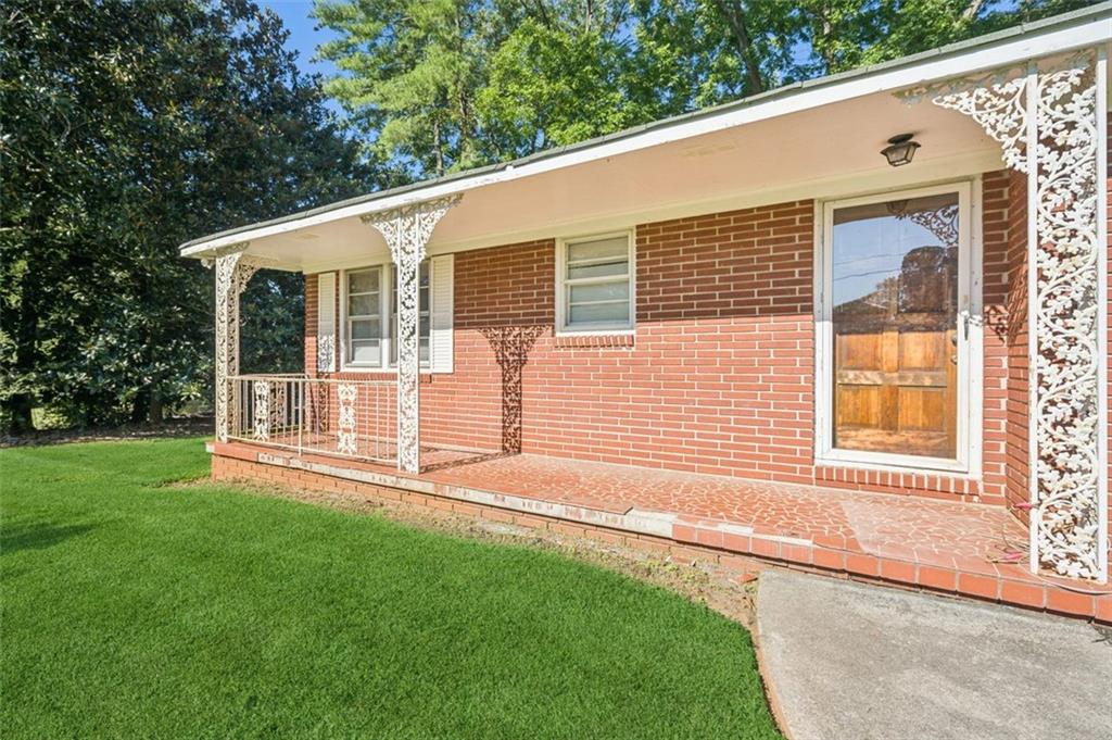13890 Cowart Road Alpharetta, GA 30004 - Photo 7 of 33 a view of a house with a yard and wooden fence