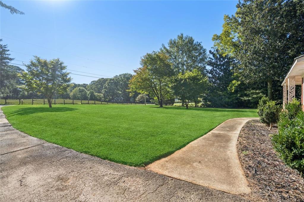 13890 Cowart Road Alpharetta, GA 30004 - Photo 8 of 33 a view of a garden with trees