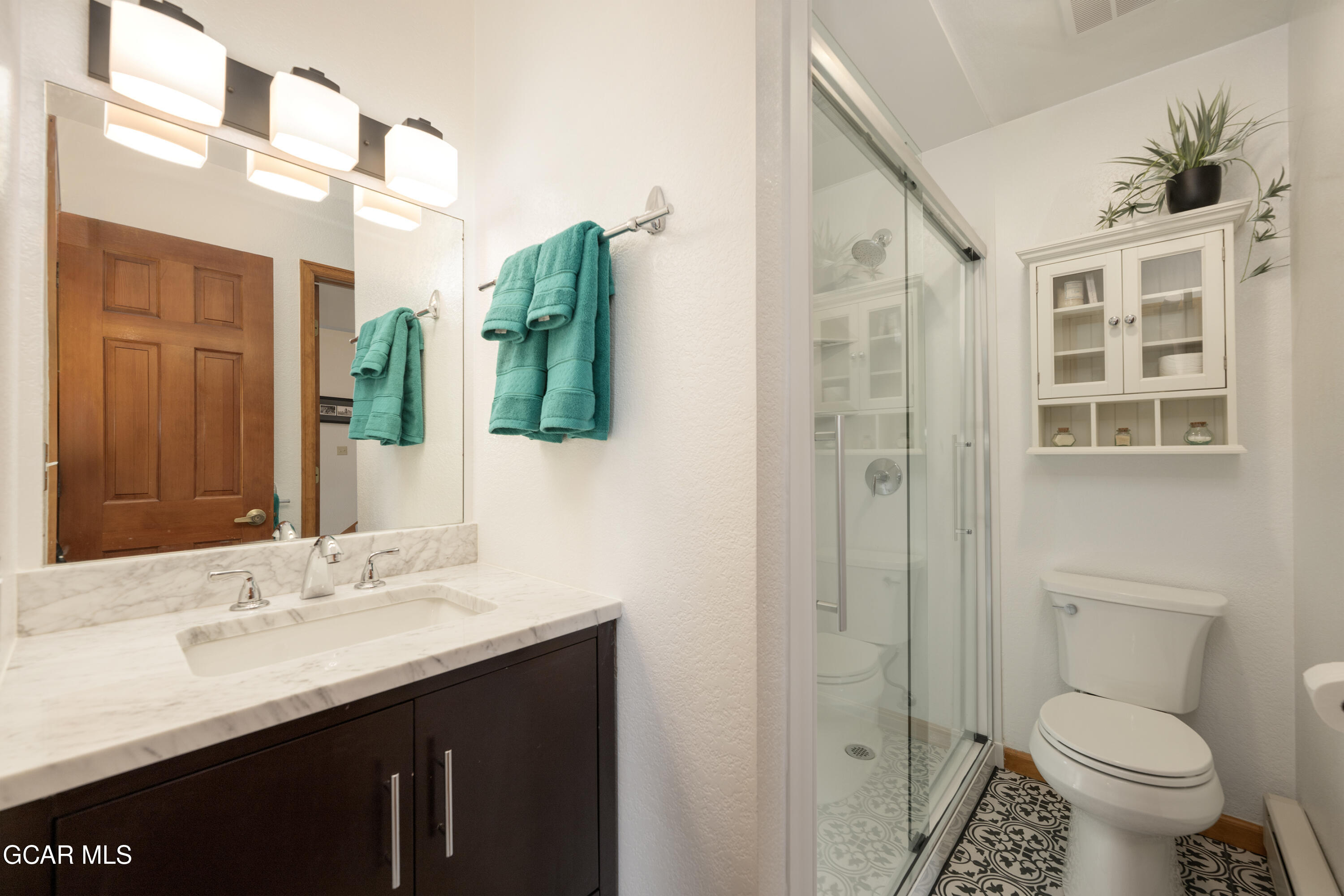 820 Wolverine Lane, Unit 3 Fraser, CO 80442 - Photo 18 of 43 a bathroom with a granite countertop sink toilet and shower