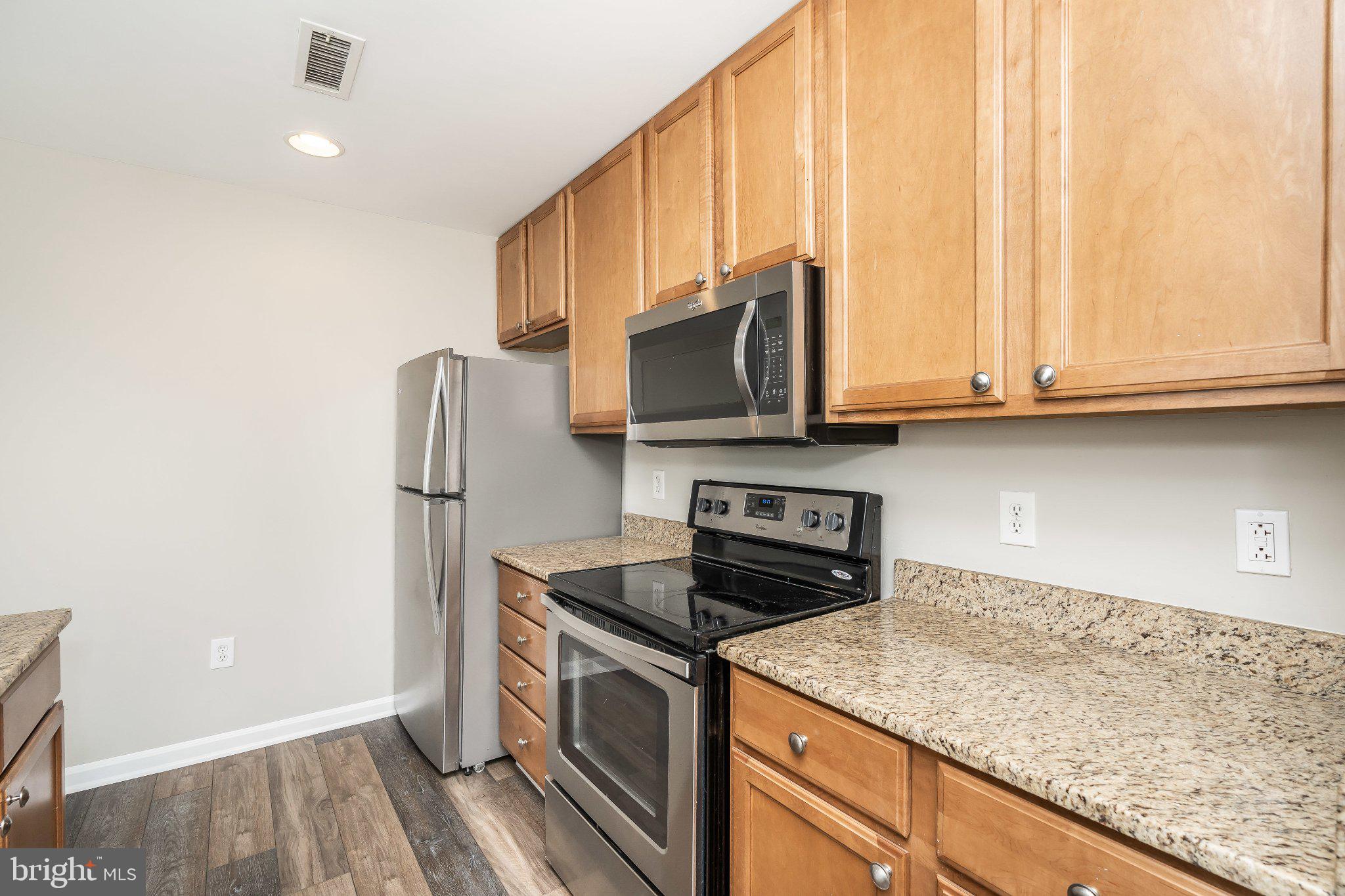 2702 Lighthouse Point East, Unit 532 Baltimore, MD 21224 - Photo 13 of 41 Modern kitchen with sleek finishes.