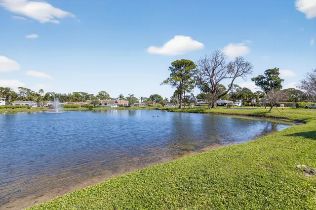 a view of a lake with houses in the back