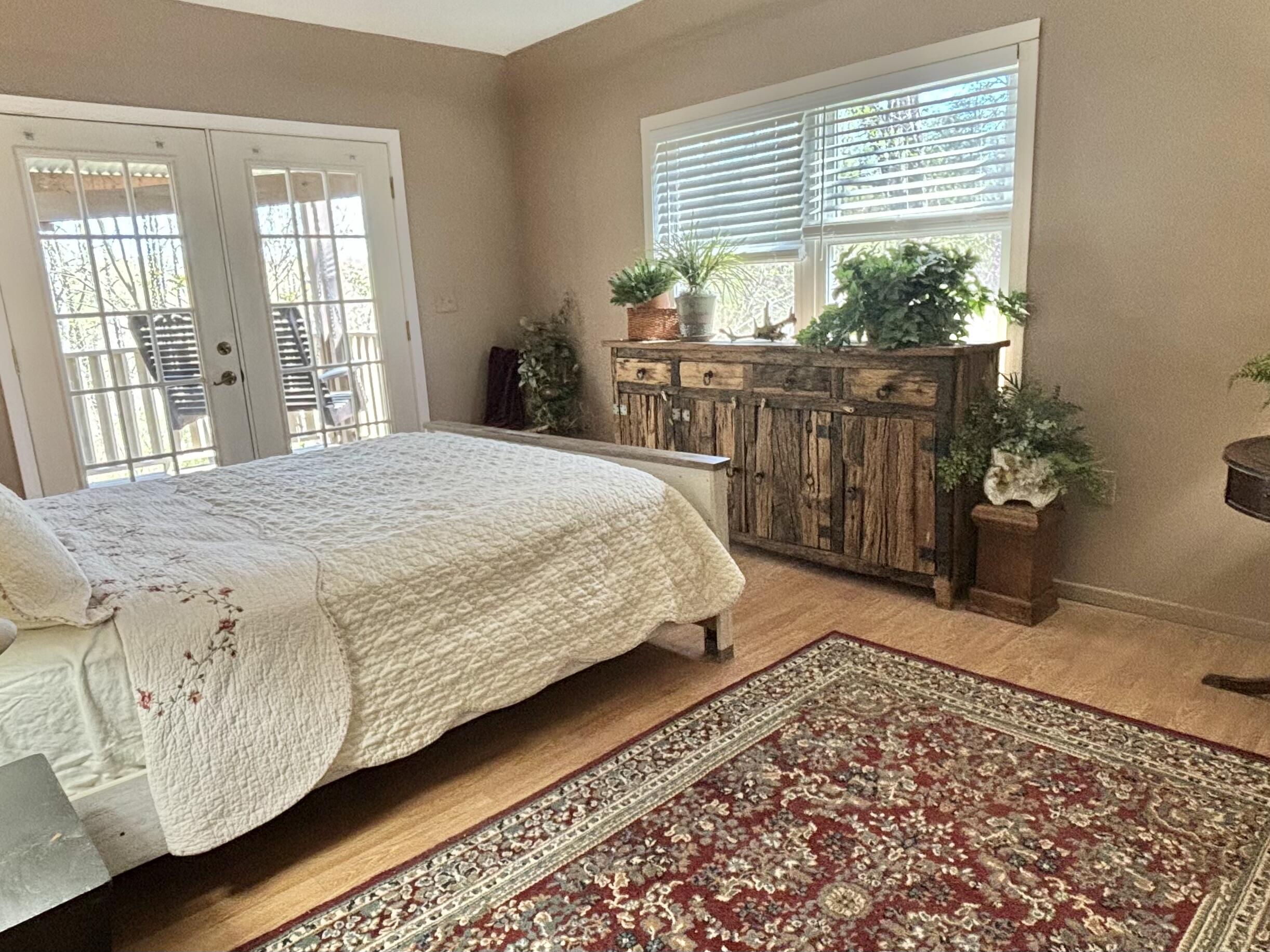 980 Power Dam Road Rocky Mount, VA 24151 - Photo 15 of 55 a bed sitting in a bedroom next to a window