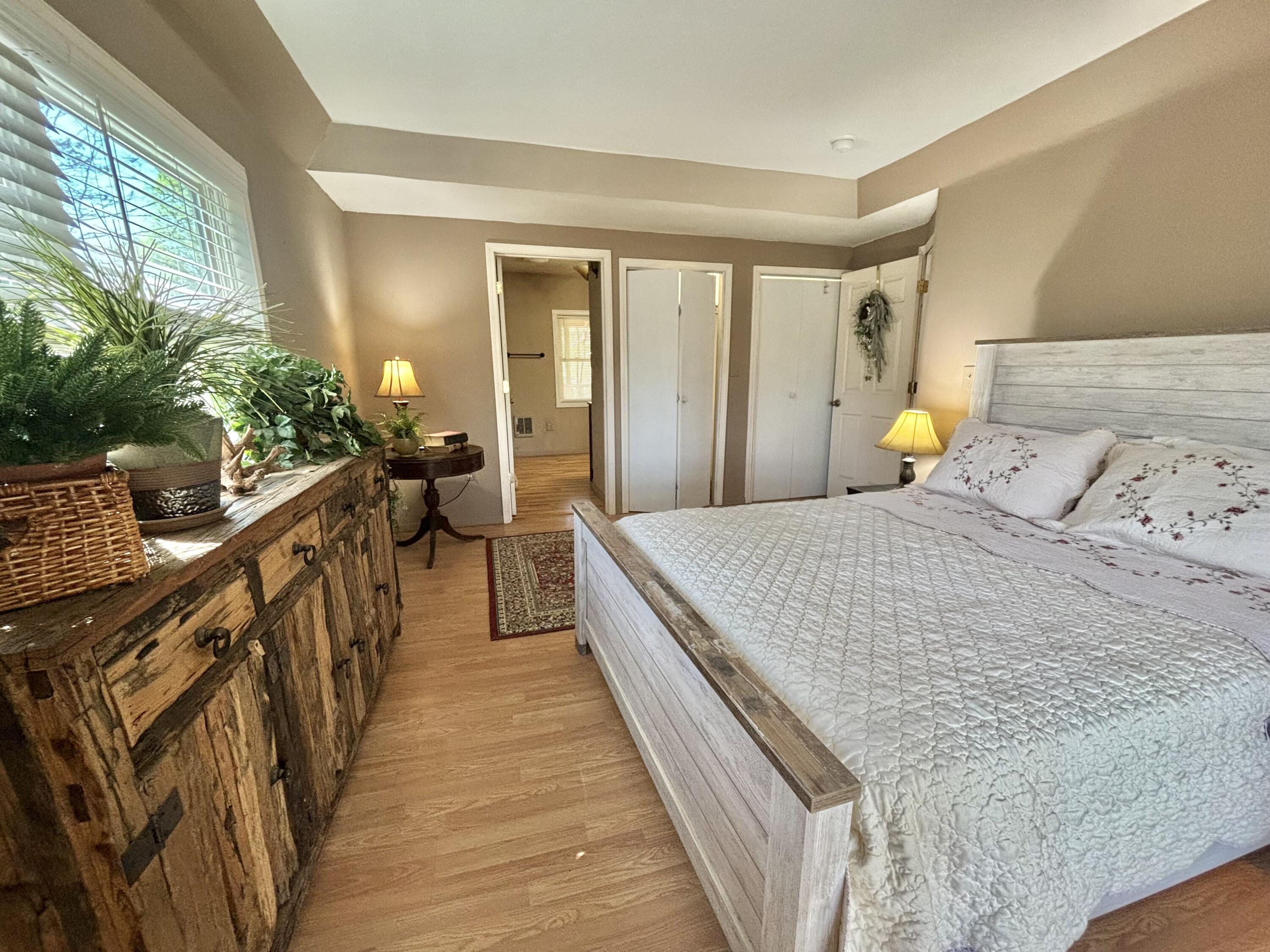 980 Power Dam Road Rocky Mount, VA 24151 - Photo 17 of 55 a view of a bedroom with wooden floor and stairs