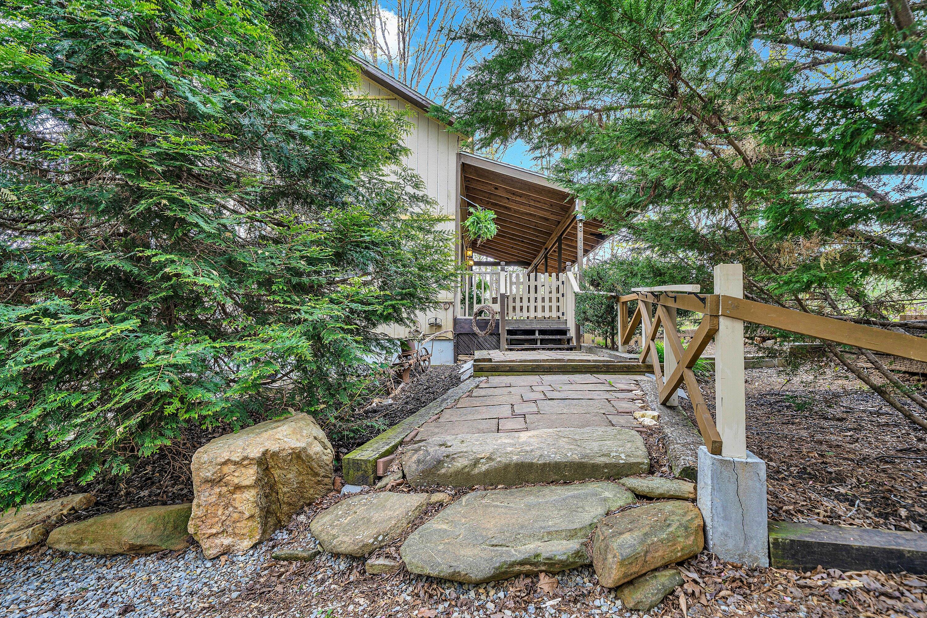 980 Power Dam Road Rocky Mount, VA 24151 - Photo 2 of 55 a backyard of a house with outdoor seating