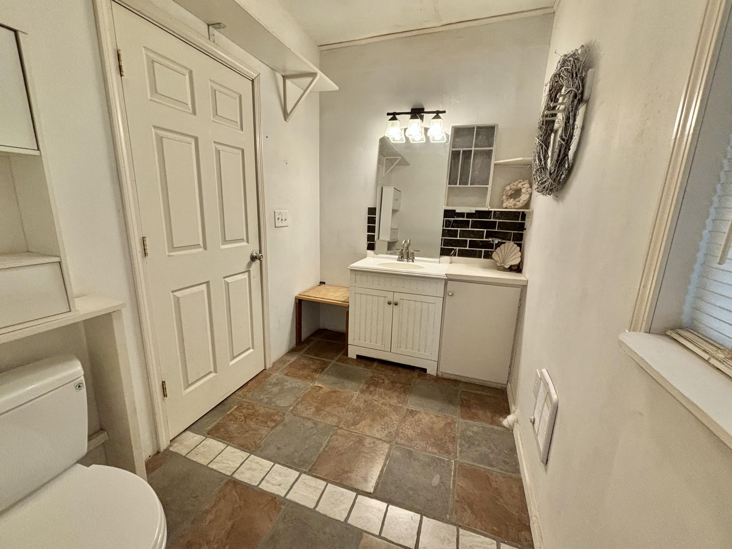 980 Power Dam Road Rocky Mount, VA 24151 - Photo 39 of 55 a bathroom with a sink a toilet and shower