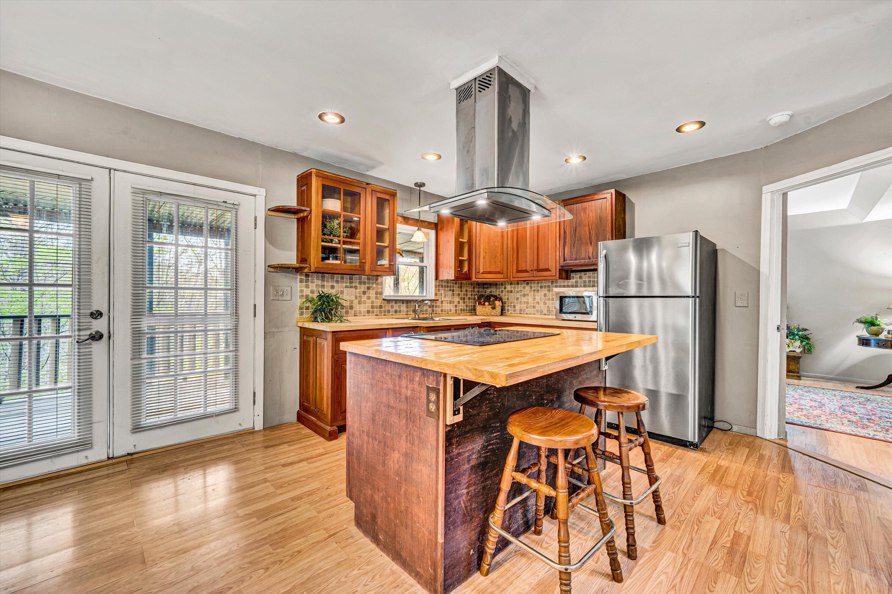 980 Power Dam Road Rocky Mount, VA 24151 - Photo 9 of 55 a kitchen with stainless steel appliances granite countertop a refrigerator a sink and a stove