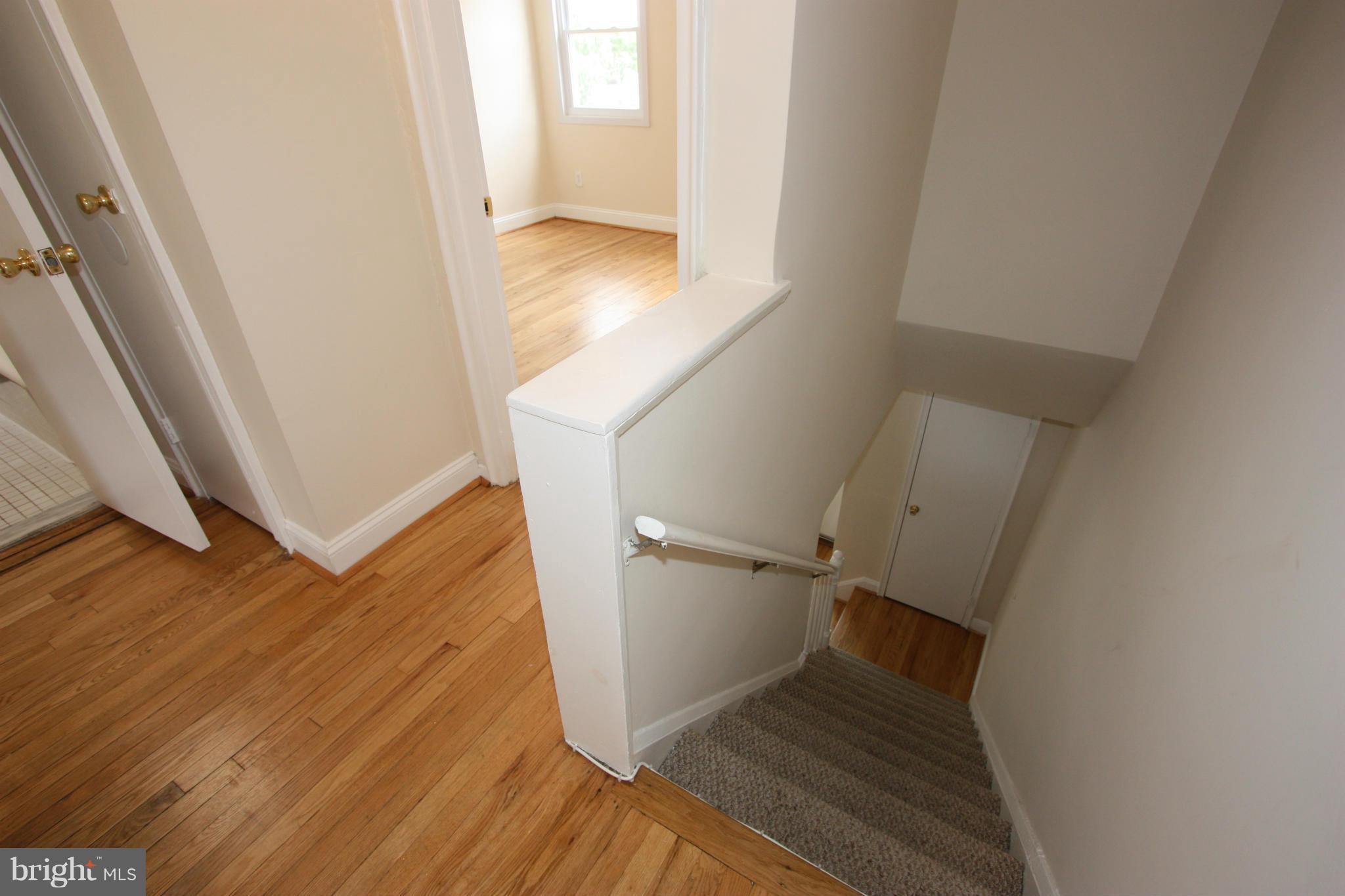 1018 Wedgewood Road Baltimore, MD 21229 - Photo 18 of 30 STAIRWAY AND 2ND FLOOR HALLWAY
