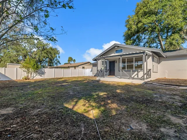 a front view of a house with yard