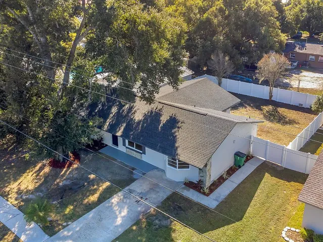 a view of a backyard with sitting area