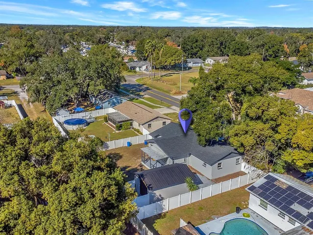 an aerial view of residential houses with outdoor space