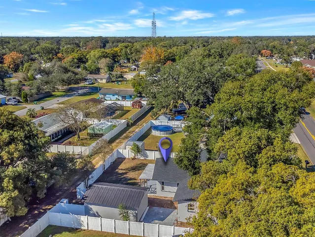 an aerial view of residential houses with outdoor space