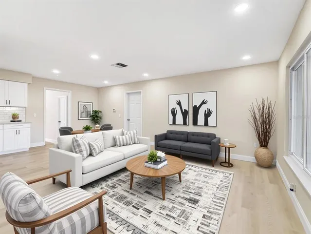 a living room with furniture and a rug