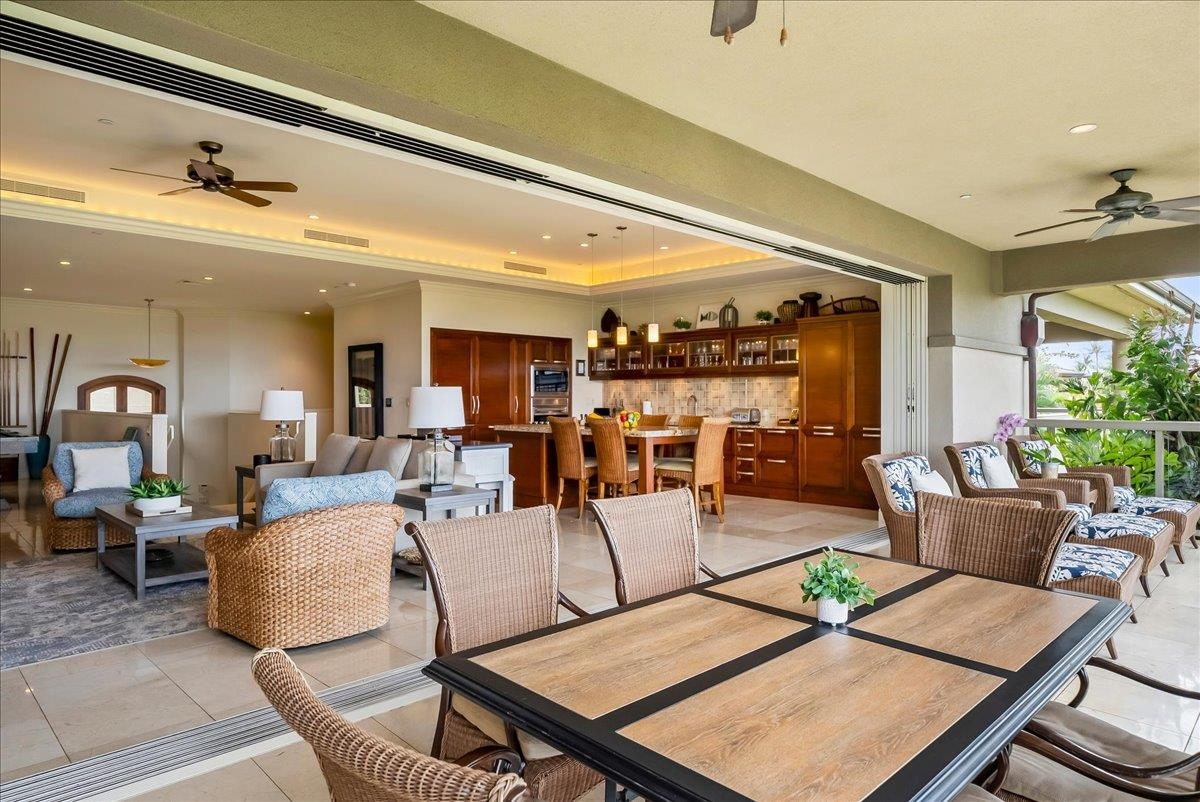 21 Kiloa Street, Unit 4 Kihei, HI 96753 - Photo 23 of 50 a living room with lots of furniture and view of kitchen
