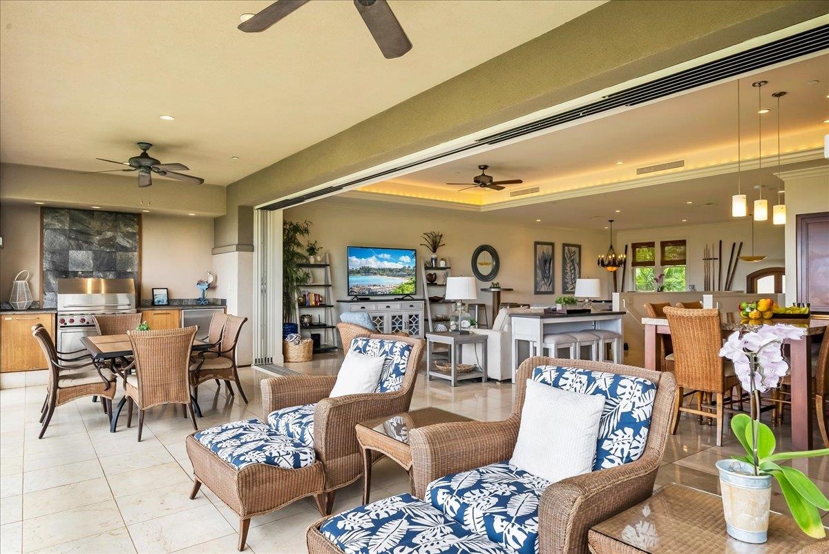 21 Kiloa Street, Unit 4 Kihei, HI 96753 - Photo 24 of 50 a living room with lots of furniture and view of kitchen