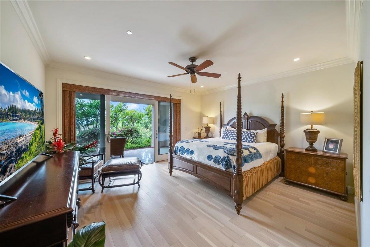 21 Kiloa Street, Unit 4 Kihei, HI 96753 - Photo 25 of 50 a living room with furniture flat screen tv and a large window