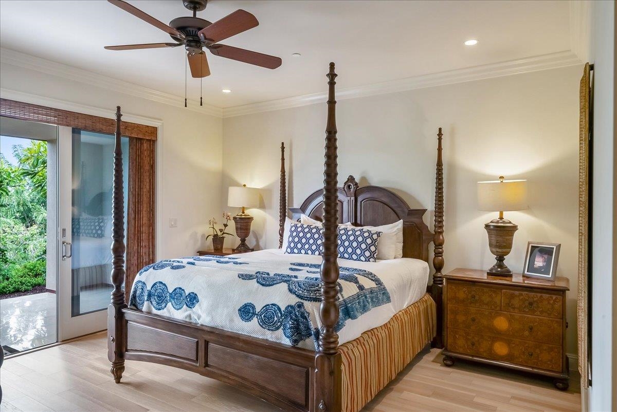 21 Kiloa Street, Unit 4 Kihei, HI 96753 - Photo 27 of 50 a bedroom with a bed a large window with the wooden floor