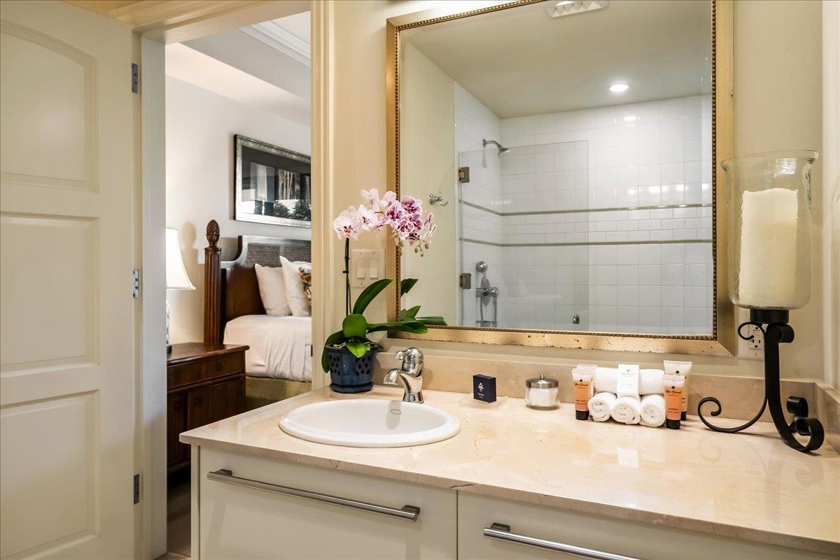 21 Kiloa Street, Unit 4 Kihei, HI 96753 - Photo 38 of 50 a bathroom with a sink and a mirror