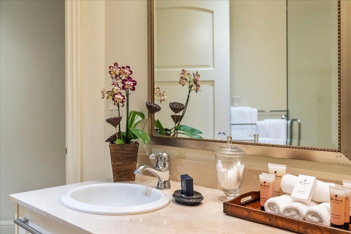 21 Kiloa Street, Unit 4 Kihei, HI 96753 - Photo 42 of 50 a bathroom with a sink and a mirror