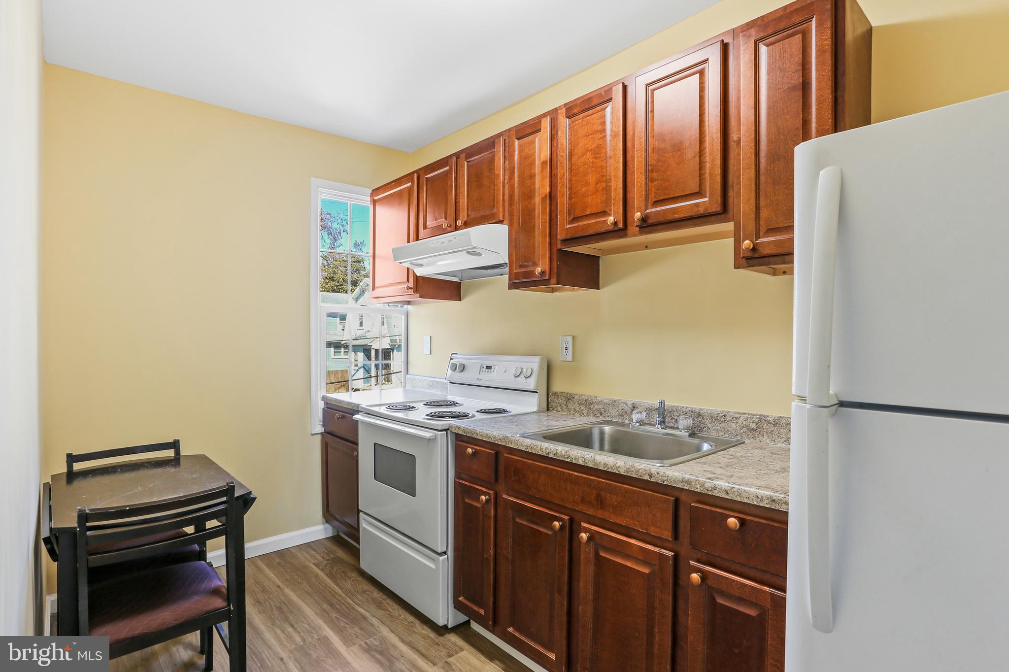 6812 Harford Road Baltimore, MD 21234 - Photo 18 of 33 Upper Level Galley Kitchen w/ Tablespace