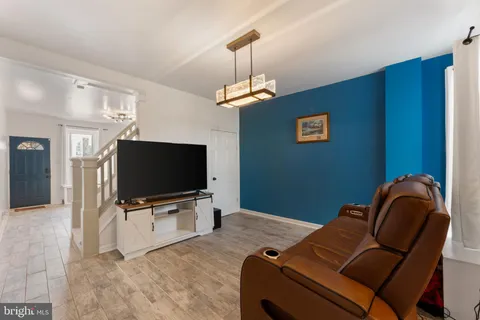 a bedroom with a bed and flat screen tv