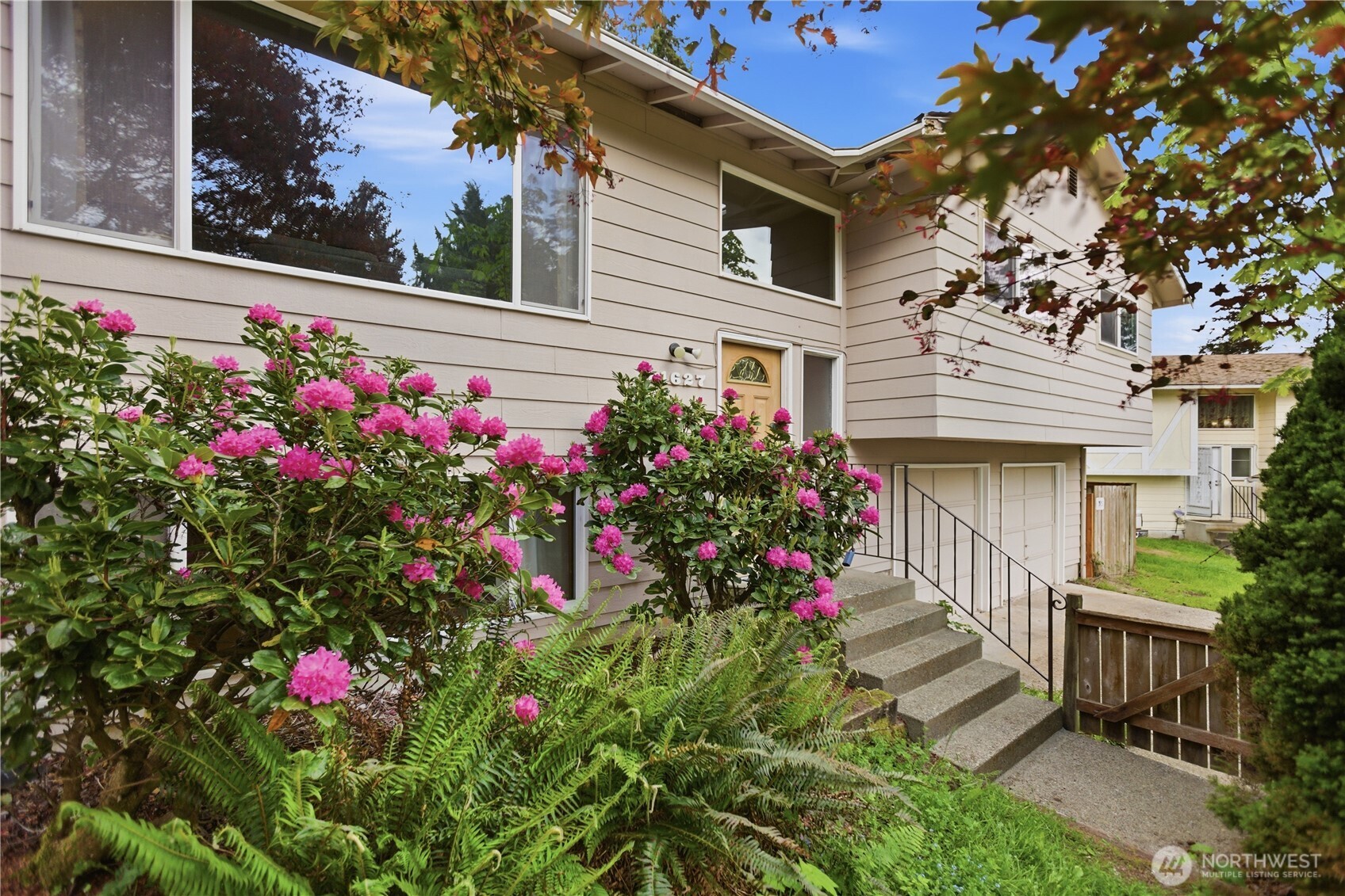 21627 9th Place West Bothell, WA 98021 - Photo 2 of 40 a view of a house with a flower garden