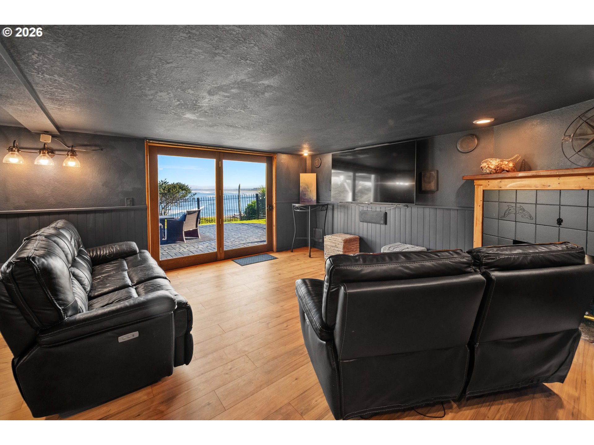 3232 Sunset Boulevard Seaside, OR 97138 - Photo 36 of 48 a living room with furniture and a flat screen tv