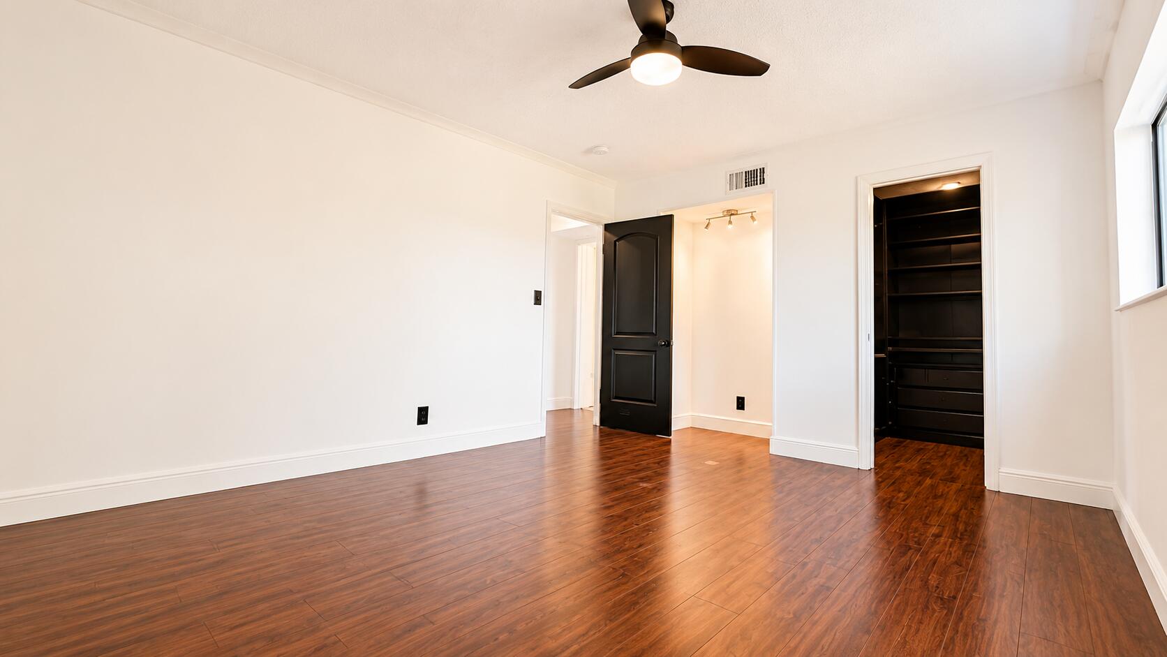 8801 West Sample Road, Unit 4 Coral Springs, FL 33065 - Photo 6 of 19 Bright Master Bedroom with Wood Floors