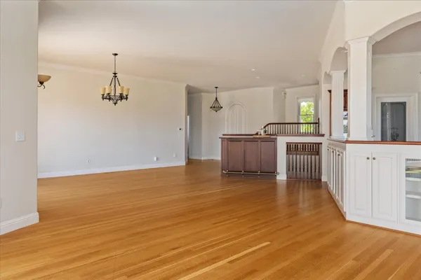 a view of a kitchen with a sink and microwave