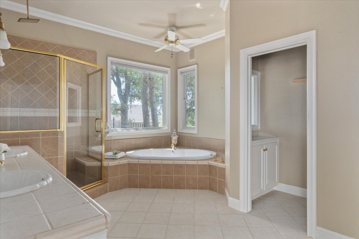 643 Miwuk Way Angels Camp, CA 95222 - Photo 21 of 55 a spacious bathroom with a tub shower and sink