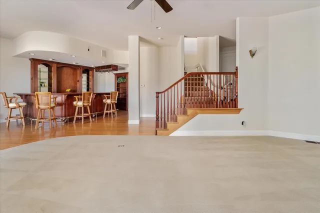 wooden floor fireplace and windows in a room
