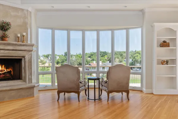 a view of a dining room with furniture window and wooden floor