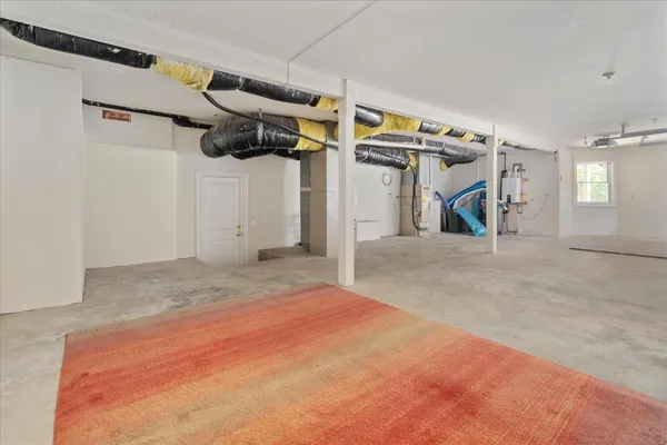 an aerial view of a swimming pool with lawn chairs and plants