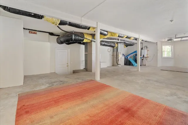 a view of a backyard with table and chairs and a fire pit