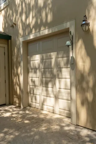 an aerial view of a swimming pool with lawn chairs and plants