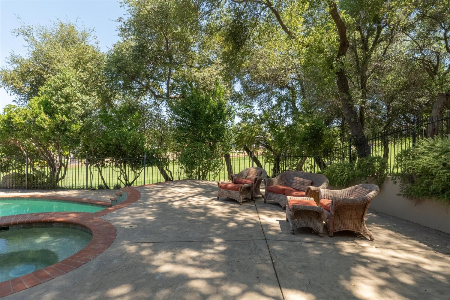 643 Miwuk Way Angels Camp, CA 95222 - Photo 46 of 55 a view of a backyard with table and chairs and a fire pit