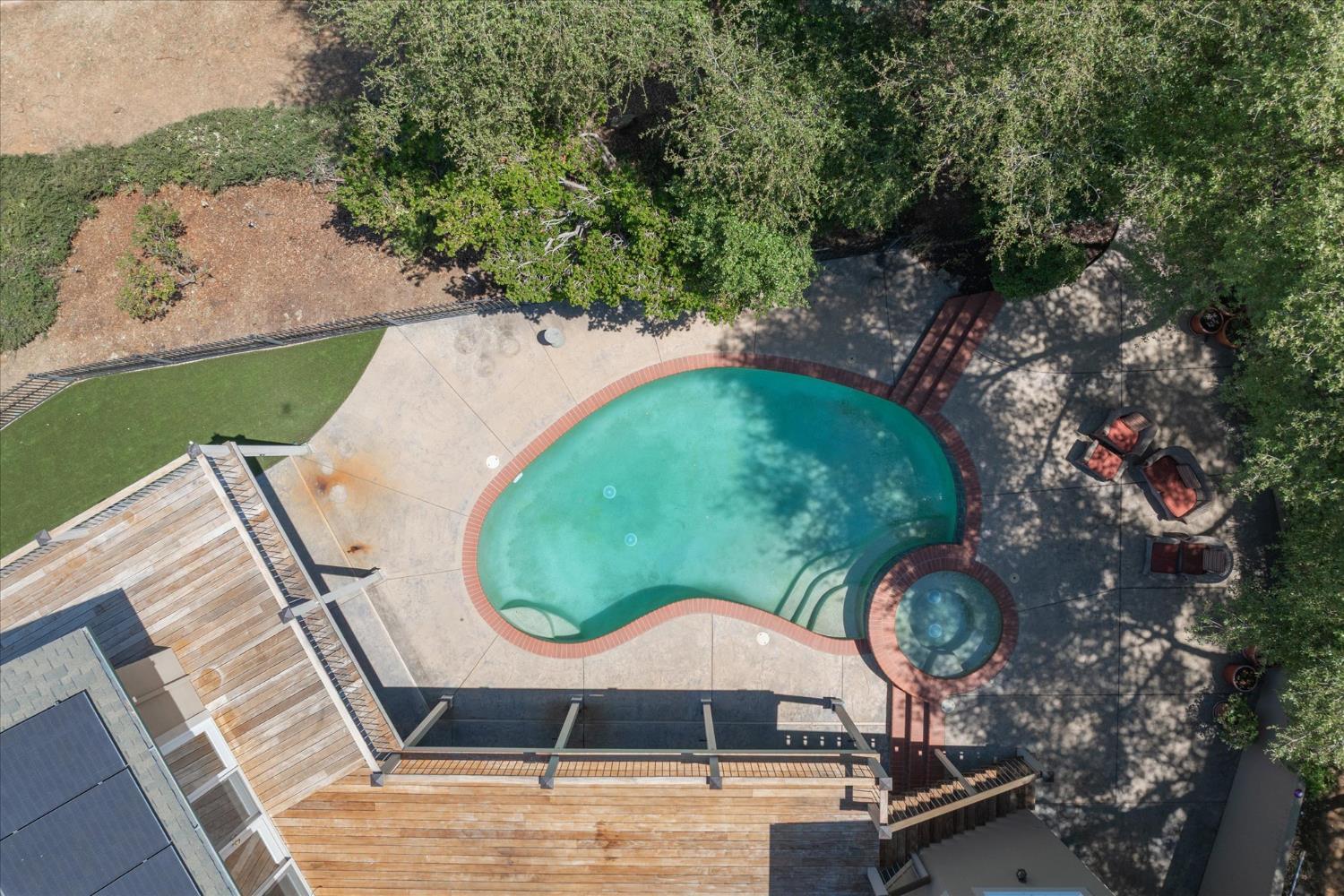 643 Miwuk Way Angels Camp, CA 95222 - Photo 50 of 55 an aerial view of a swimming pool with lawn chairs and plants