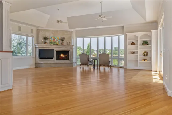 a living room with fireplace furniture and a flat screen tv