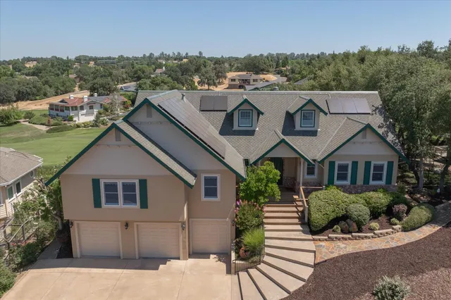 a aerial view of a house with a yard